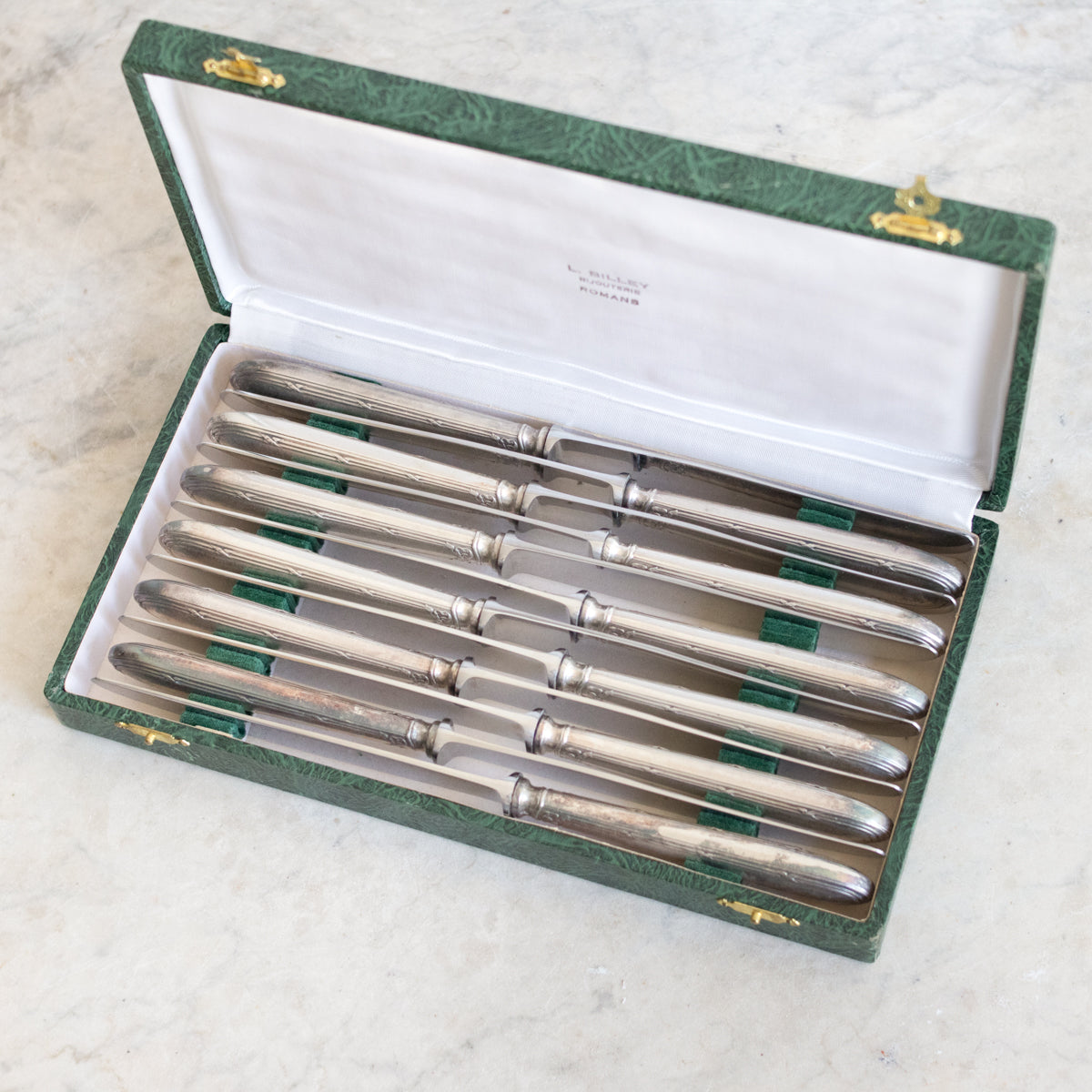 Ensemble de 12 couteaux vintage en argent
